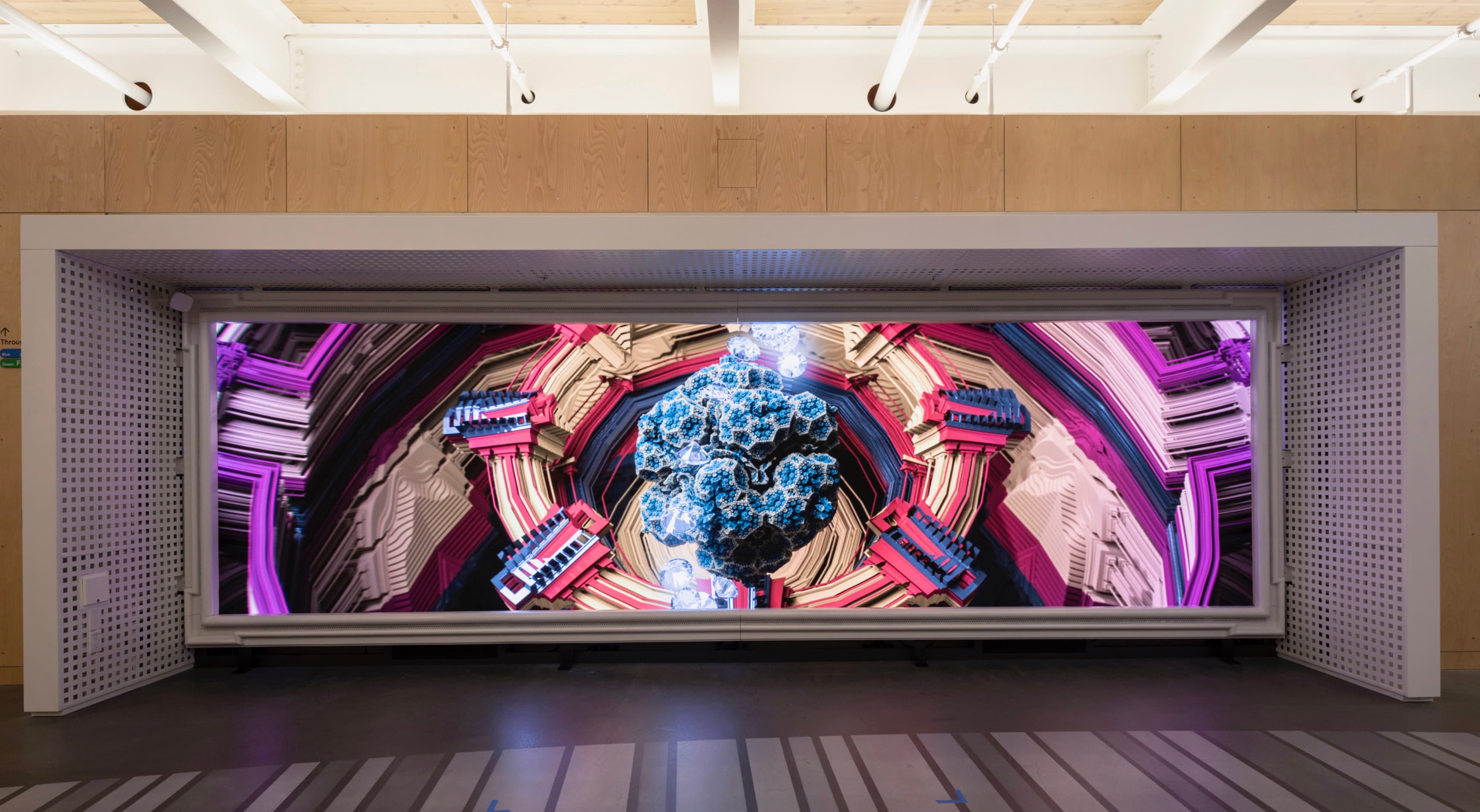 Generative artwork with geometric architecture and a suspended blue form on a panoramic display